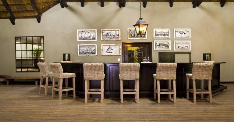 Bar and gallery wall at Mushara Lodge