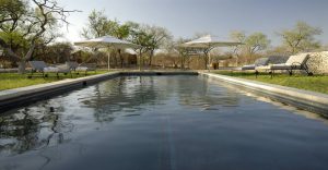 Swimming pool and loungers at Mushara Outpost near Etosha