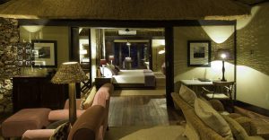 Private lounge and bedroom inside a Little Ongava villa