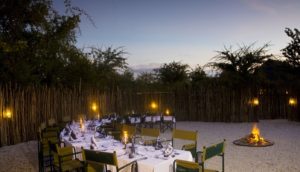 Outdoor dinner setting at Mushara Bush Camp