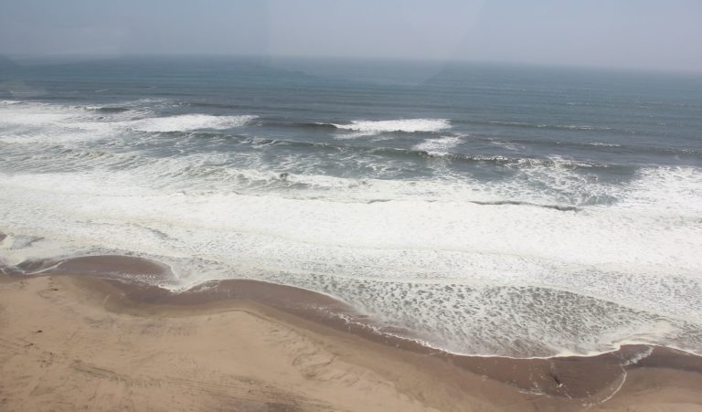 Terrace Bay Namibia – aerial view of surf meeting the desert