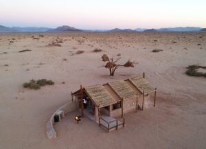 self-catering accommodation near Sossusvlei – aerial view of chalet and desert plain