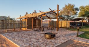 Desert Camp Sesriem – communal boma with central fireplace