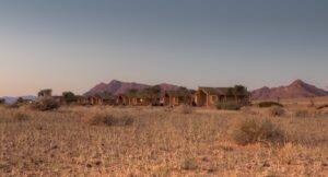 Sesriem desert camp – rows of chalets against desert mountains