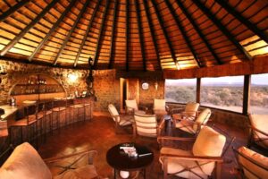 Okonjati Game Reserve lodge – circular lounge overlooking the water