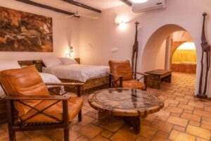 Okonjati Game Reserve lodge – large guest suite with separate sitting area