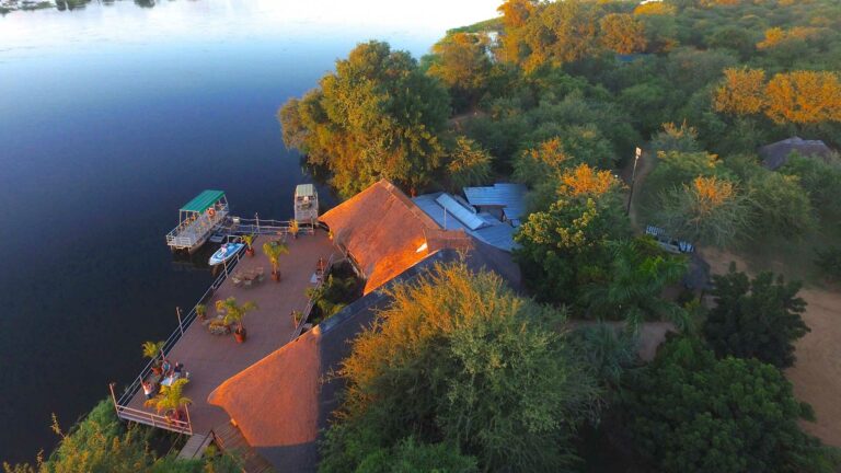 Nunda River Lodge – aerial view of river decks and thatched roofs
