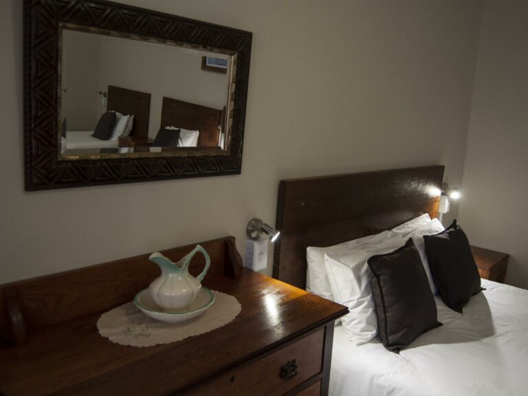 Lüderitz guesthouse – tea tray beside a guest bed