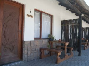 Obelix Guesthouse – private room entrance and bench