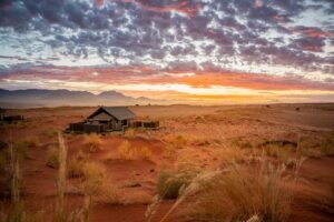 NamibRand accommodation – remote camp at sunset