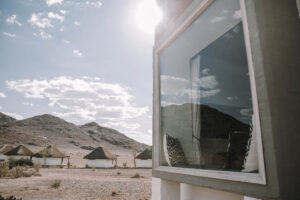 Desert Homestead Lodge – reflective cottage window