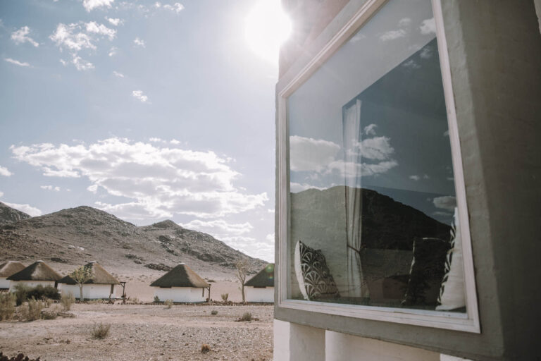 Desert Homestead Lodge – reflective cottage window
