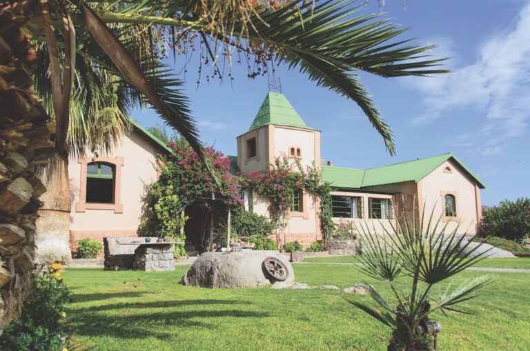 Landscaped garden and main building at Canyon Lodge