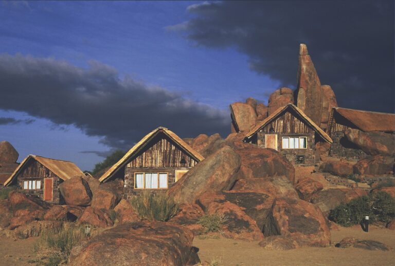 Canyon Lodge chalets illuminated among granite boulders