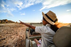 Canyon Lodge guest viewing the reserve from an open vehicle