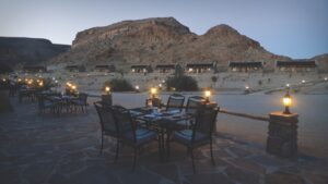 Outdoor dining terrace at Canyon Village after sunset