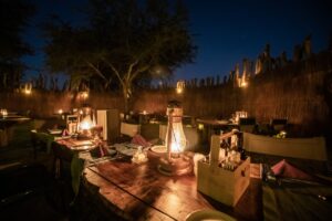 Lantern-lit outdoor dining table at Chobe River Camp