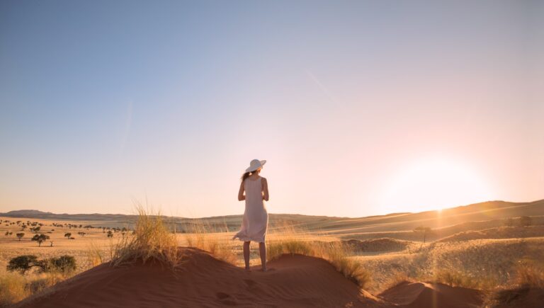 Guest walking across the dunes near Desert Whisper