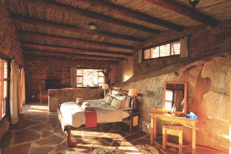 Twin beds inside Eagles Nest Chalets accommodation