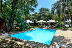 Swimming pool in the gardens at Hakusembe River Lodge