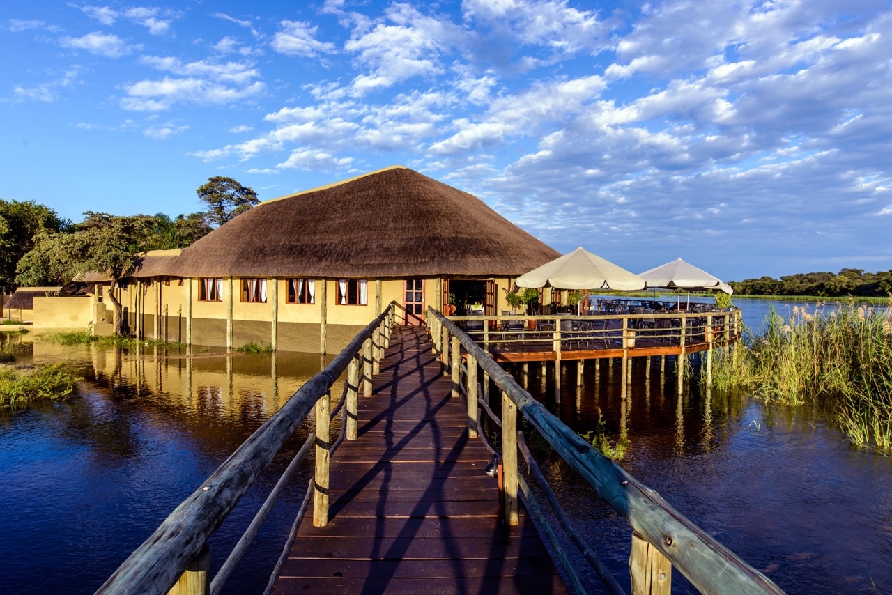 Hakusembe River Lodge deck and thatched restaurant beside the Okavango River