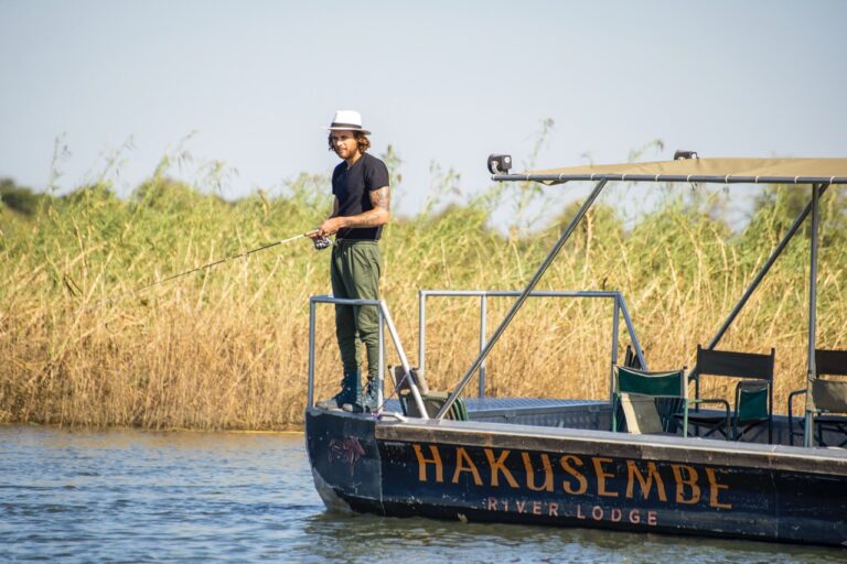 Guest fishing from a Hakusembe River Lodge boat