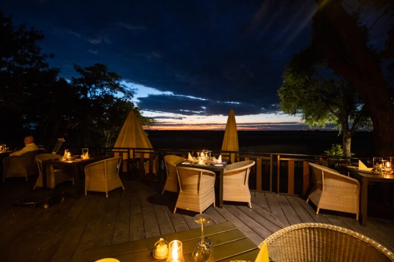 Candlelit outdoor dining at this Kwando River lodge