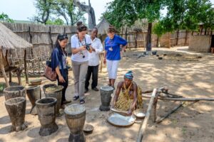 Guests learning about local crafts on a village visit