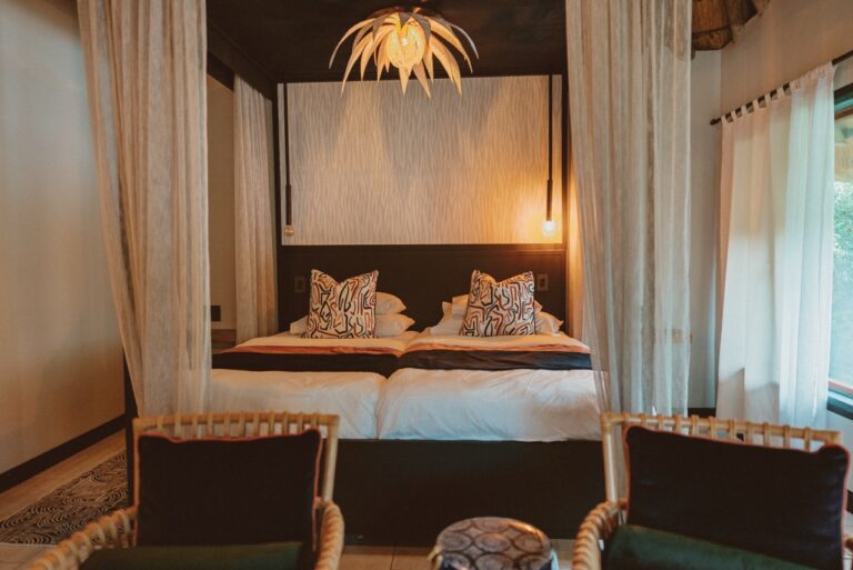 Mosquito-netted bedroom in a Kwando River lodge room
