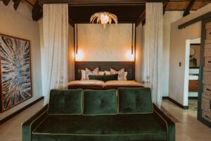 Double room with sofa at Namushasha River Lodge