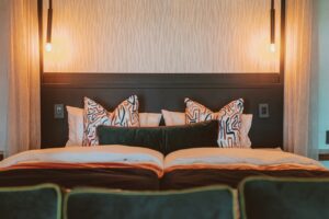 Double bed in a modern Namushasha River Lodge room