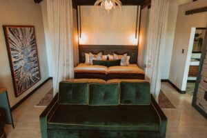 Double room with sofa at Namushasha River Lodge