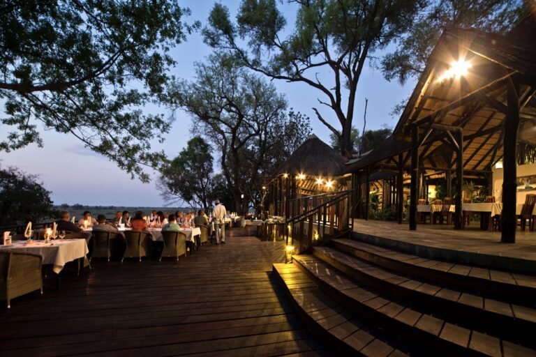 Outdoor dining deck at Namushasha River Lodge