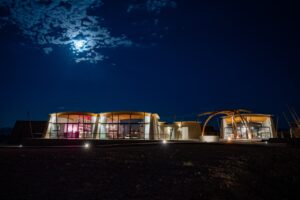 The Desert Grace central lodge beneath the night sky