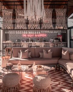 Pink-accented guest lounge inside The Desert Grace