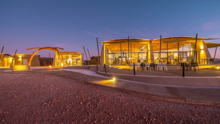 Wide exterior view of The Desert Grace lodge