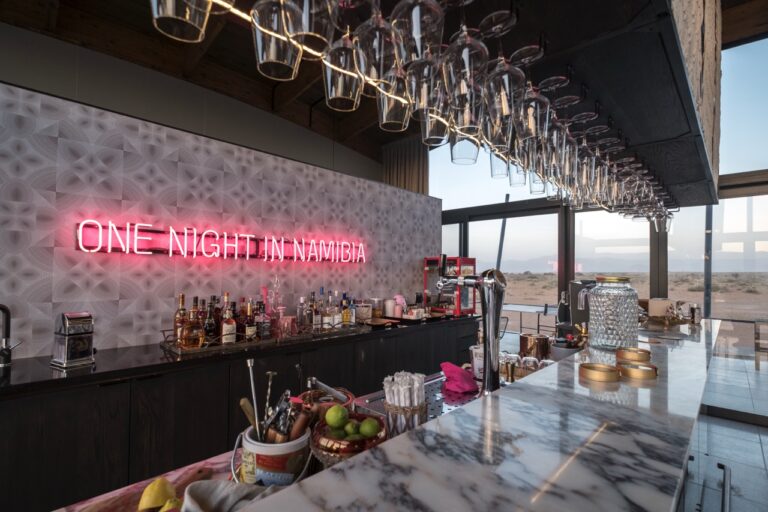 Bar counter and neon sign at The Desert Grace