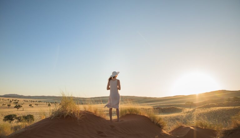 Solo traveller watching the desert near The Desert Grace