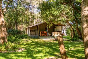 Shaded self-catering tents in the gardens at Zambezi Mubala Camp