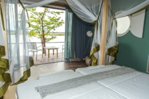 Mosquito-netted bedroom at Zambezi Mubala Lodge