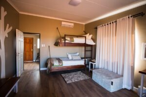 Family room with bunk beds at Kalahari Anib Lodge