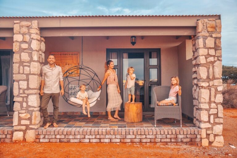 Family outside a Kalahari Anib Lodge room