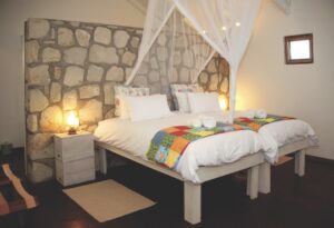 Double bungalow bedroom at Kalahari Farmhouse in Stampriet
